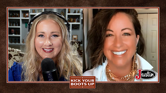 A woman with blonde hair and a woman with brown hair looking at the camera, smiling, and having a conversation.